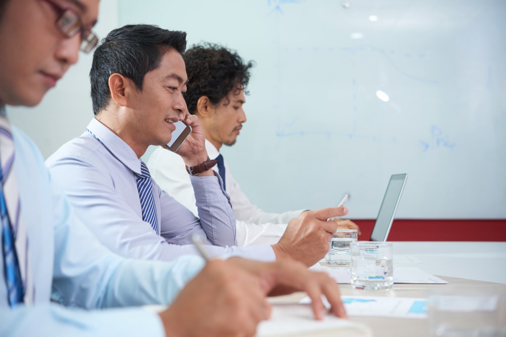 Support 3 business executive having phone call